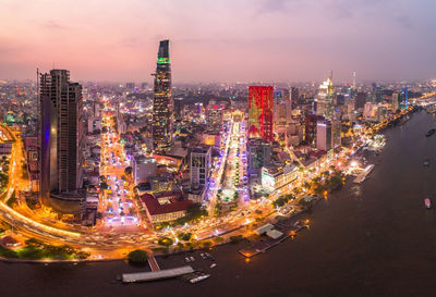 Aerial view of city lit up at night