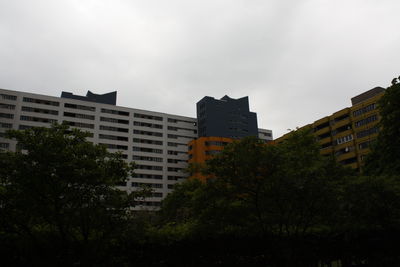 Buildings in city against sky