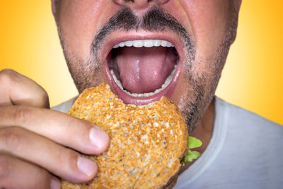 Cropped hand of woman holding food