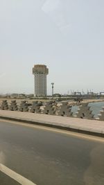 Buildings in city against clear sky