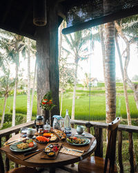 Table and chairs in front of window