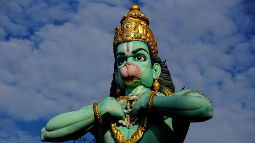 Low angle view of statue against sky