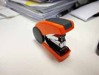 High angle view of stapler on table