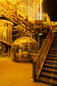 Illuminated staircase of building at night