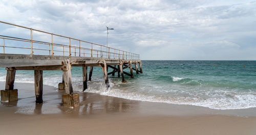 Pier on sea against sky