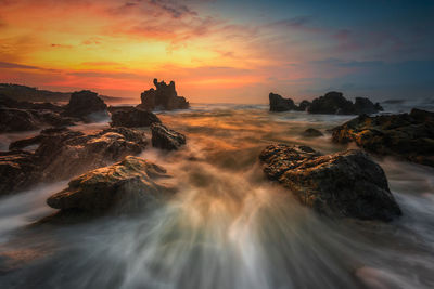 Scenic view of sea against sky during sunset