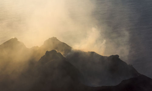 Low angle view of mountains against sky during sunset