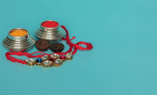 High angle view of various coins on blue background