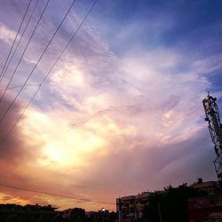 Low angle view of building against sky at sunset