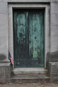 Abandoned old mausoleum doors in a cemetery
