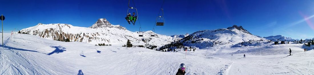 Low angle view of ski lift against clear sky