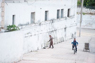 Men on road in city