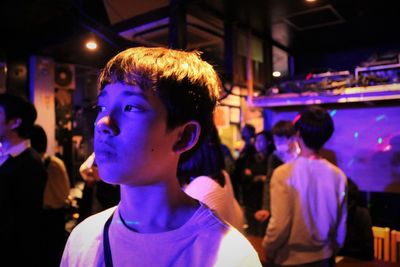 Thoughtful boy looking away in party