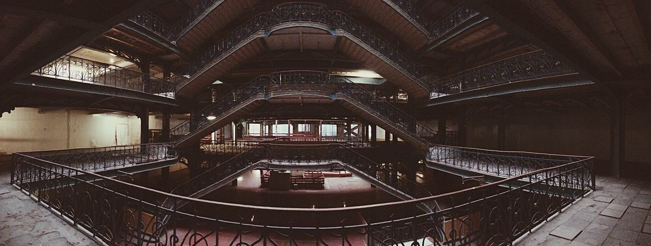 indoors, architecture, built structure, pattern, steps, ceiling, window, wood - material, steps and staircases, staircase, low angle view, railing, design, door, house, no people, architectural feature, arch, day, old