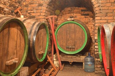 Old cellar with wooden barrels. traditional making wine. wine cellar with the oak barrels