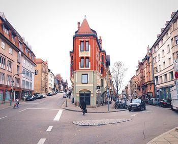 Street and buildings against sky