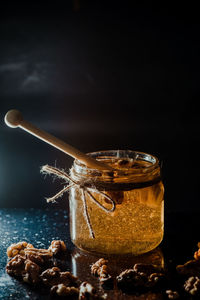 Close-up of coffee on table against black background