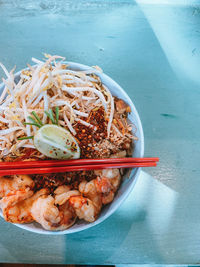 High angle view of asian pad thai in plate on table