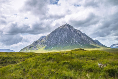 Scenic view of landscape and mountain against sky