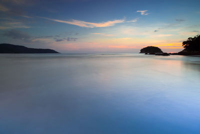 Scenic view of sea against sky at sunset