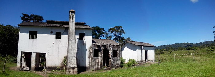 Built structure on grassy field against clear sky