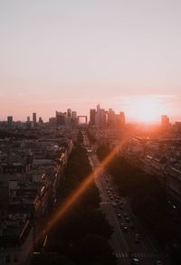 High angle view of buildings in city during sunset