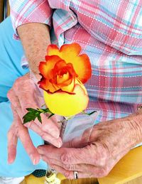 Close-up of a man holding flower