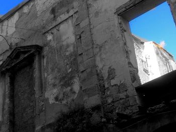 Low angle view of built structure against blue sky