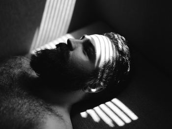 Close-up of bearded man with shadow