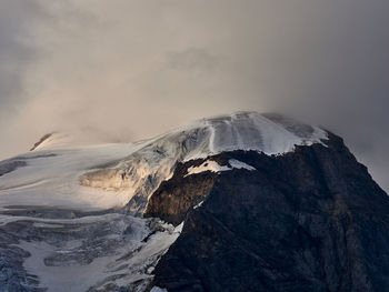 Scenic view of snowcapped mountain against sky