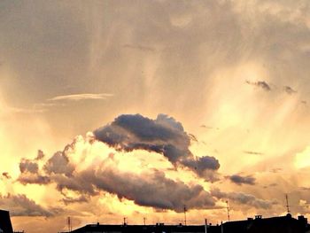 Low angle view of cloudy sky at sunset