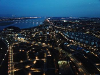 High angle view of illuminated cityscape at night