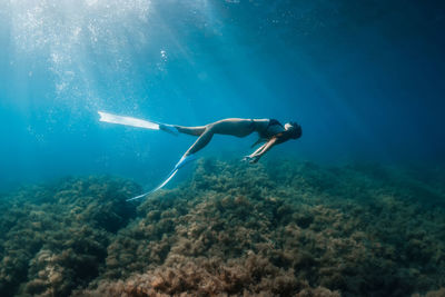 Man swimming in sea