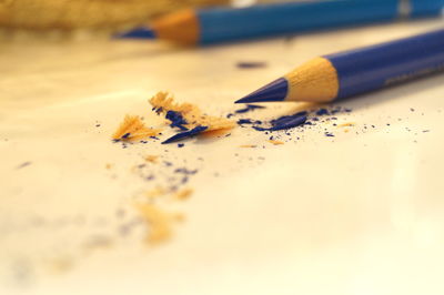 Close-up of pencil with shavings on table