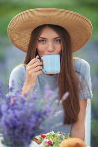 Portrait of a beautiful young woman wearing hat