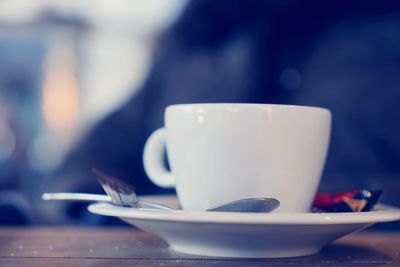 Close-up of coffee cup on table