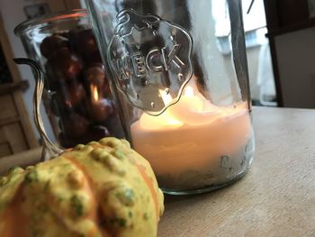 Close-up of drink in glass jar on table