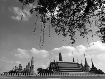 Low angle view of temple against cloudy sky