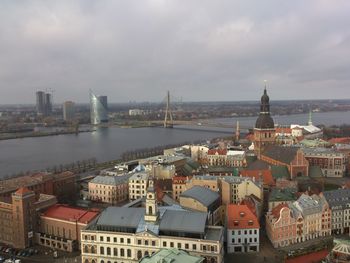 Cityscape against cloudy sky