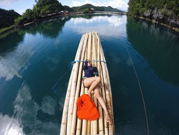 Man sitting on boat in lake