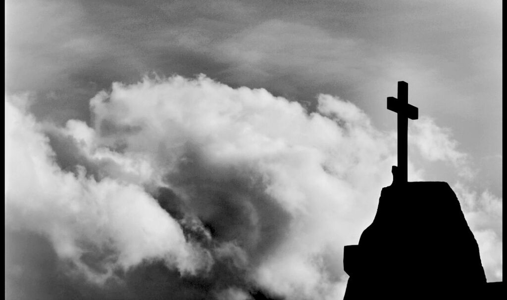 low angle view, sky, cloud - sky, silhouette, cloudy, cloud, built structure, architecture, weather, building exterior, overcast, dusk, high section, street light, outdoors, no people, cloudscape, nature, day, religion