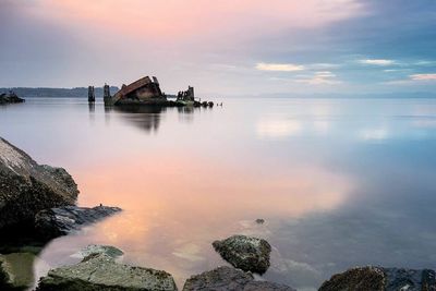 Scenic view of sea at sunset