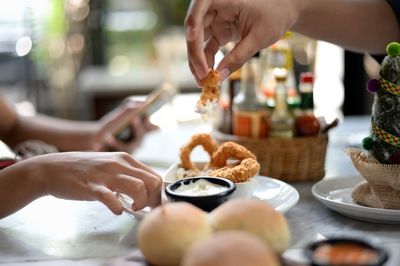 Midsection of man preparing food on table