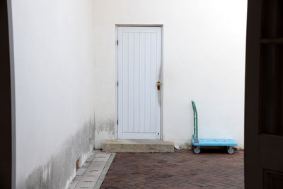 Empty wall with closed door