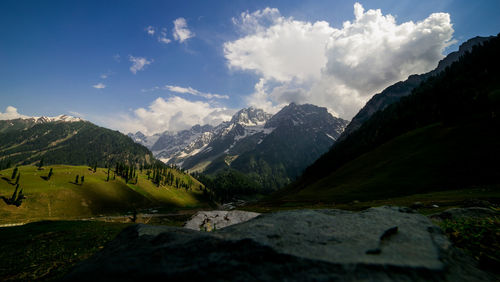 Scenic view of landscape and mountains against sky