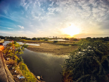 Scenic view of landscape against sky during sunset