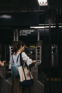 Woman standing in bus