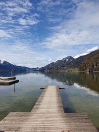 Pier over lake against sky
