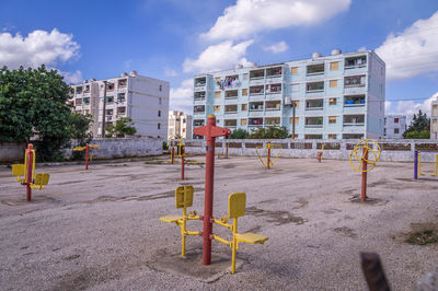 View of playground against buildings in city