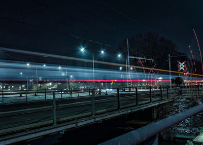 Train at railroad station at night